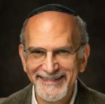 Rabbi Gordon Fuller joins Congregation Beth El as our full-time rabbi, bringing decades of experience in Jewish education, community leadership, and interfaith collaboration.
Before coming to Congregation Beth El, he served as Director of Strategic Partnerships and past Chair of the Jewish Federation of Howard County. A strong advocate for pluralism and interfaith dialogue, he was active with the Interfaith Advisory Council of Howard County and People Acting Together in Howard (PATH). He served congregation Agudath Jacob in Waco for 11 years before moving to Maryland. He has also led services online for numerous congregations, High Holidays at Virginia Tech Univ., and served Beth Shalom in Myrtle Beach for a brief time until Covid hit. Most recently, he was the interim rabbi for Kehila Chadaha in Kensington, MD.
A native of Detroit, Rabbi Fuller holds a B.A. from Northwestern University and an M.A. in Social Work from the University of Chicago. Ordained privately by two Orthodox rabbis, he is a member of Ohalah, the association of clergy in the Jewish Renewal movement.
Rabbi Gordy, as he likes to be called, has guided individuals and families through meaningful Jewish learning and life-cycle events. He especially enjoys teaching, pastoral counseling, and accompanying people on their conversion journeys.
Rabbi Fuller and his wife, Sharon, are delighted to be making Windsor-Essex their new home and to become part of Congregation Beth El. While leaving their children and grandchildren will be challenging, they hope their family will one day find opportunities to join them in Canada.